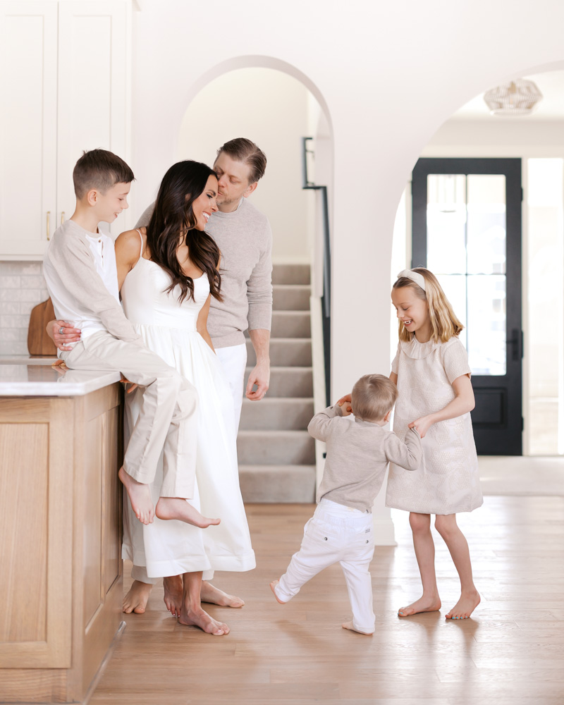 family of 5 play in their edina, minnesota kitchen for their edina family photography session with angela watts
